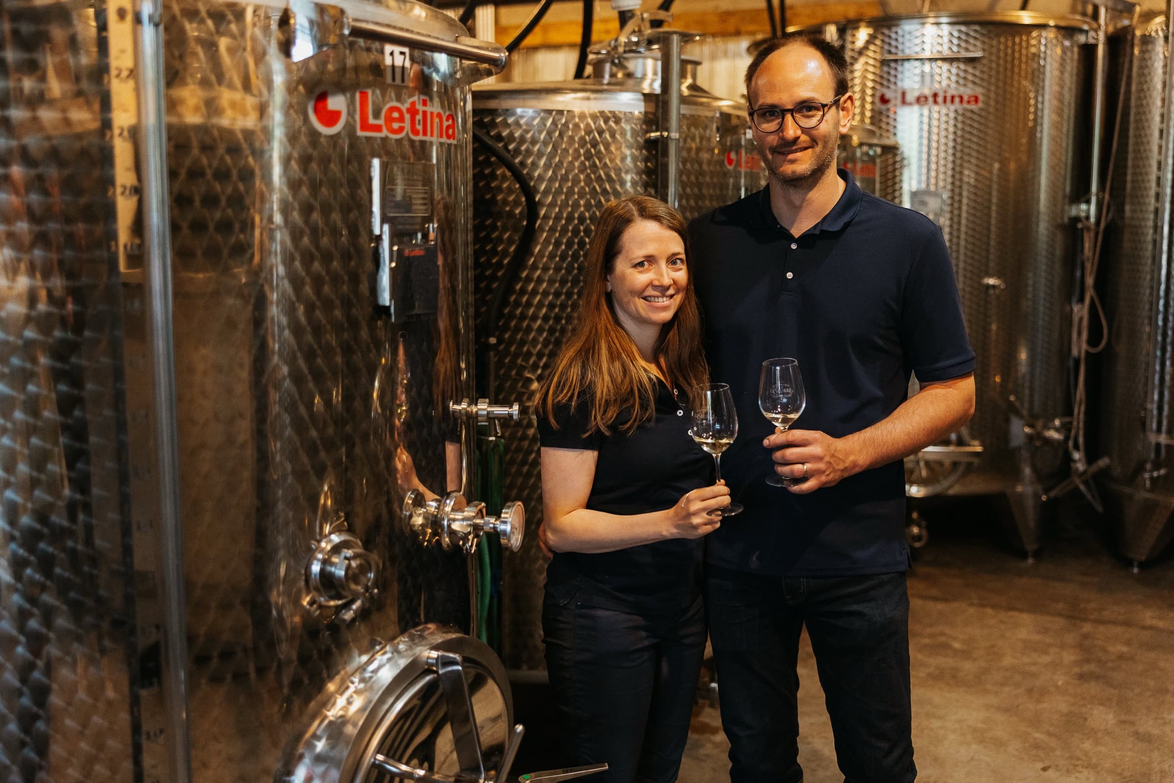 Céline and Sébastien LeSeurre among the steel tanks.